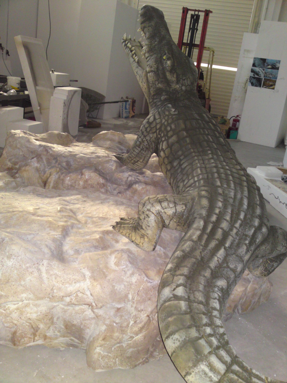 Crocodile sculpture with artificial rockwork