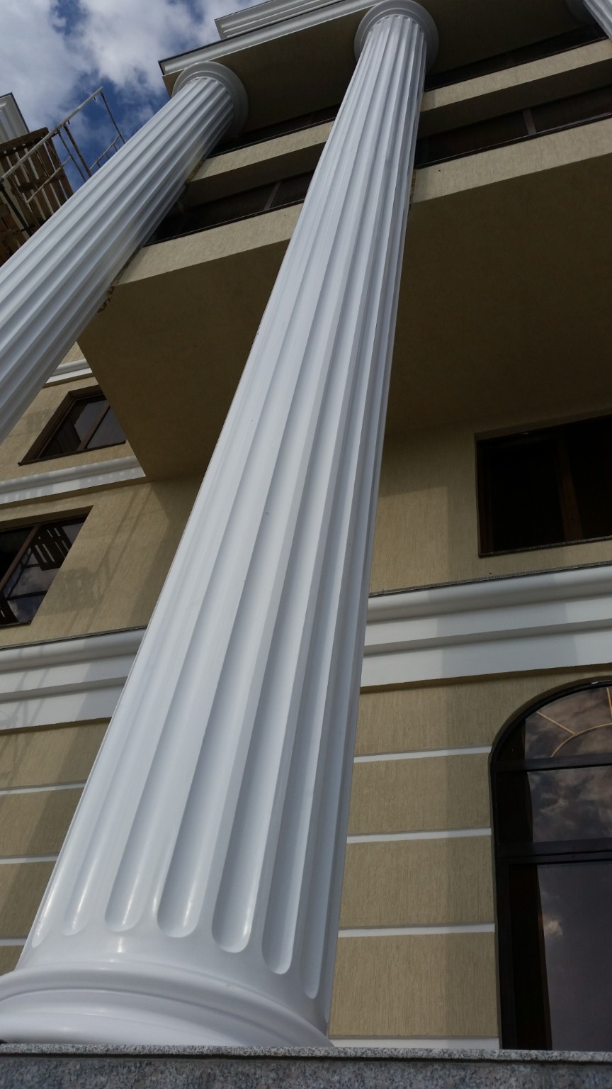 Architectural detail of tall fluted columns and cornices